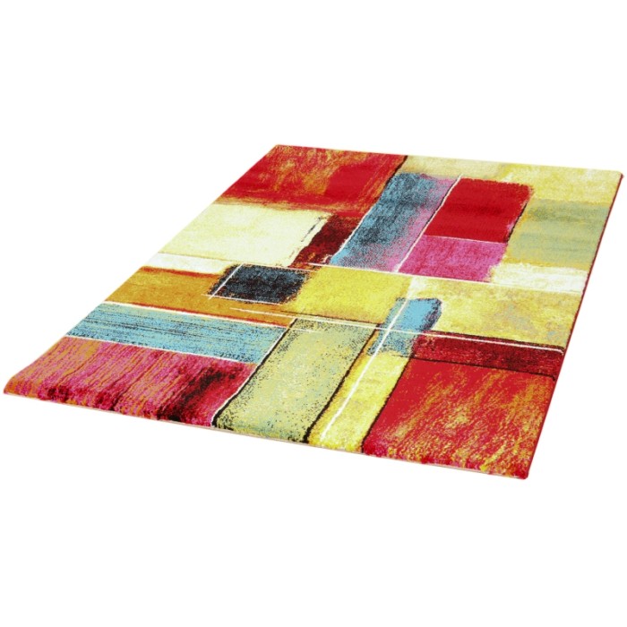 Tappeto moderno con motivo astratto in rosso, giallo e blu.