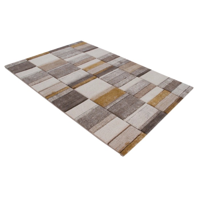 Tappeto moderno con motivo geometrico nei toni del beige, marrone e giallo.