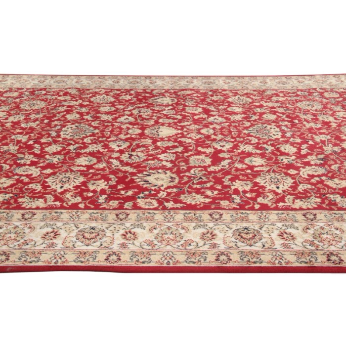 Tappeto rosso a motivi in stile classico. Ideale per soggiorni e camere da letto.