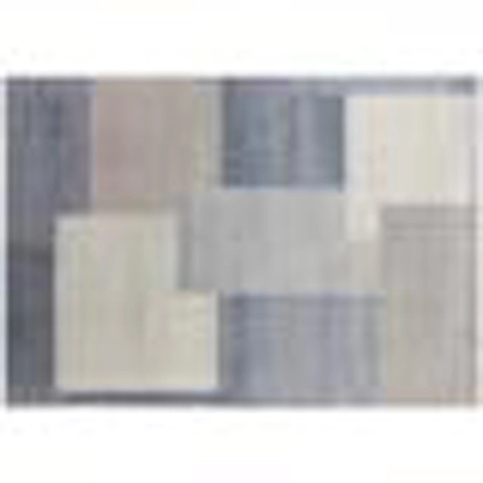 Tappeto moderno con motivo geometrico nei toni del grigio e beige.