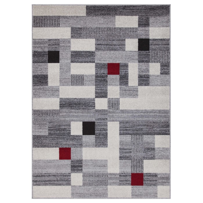 Tappeto moderno con motivo astratto in grigio, bianco, nero e rosso.