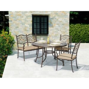 Tavolo da giardino rotondo nero OBI Outdoor Living Mansura con sedie e cuscini.