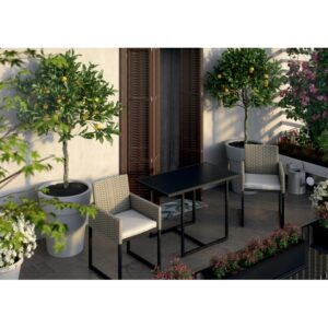 Set di mobili da giardino t.b.t. con tavolo e due sedie su un balcone.