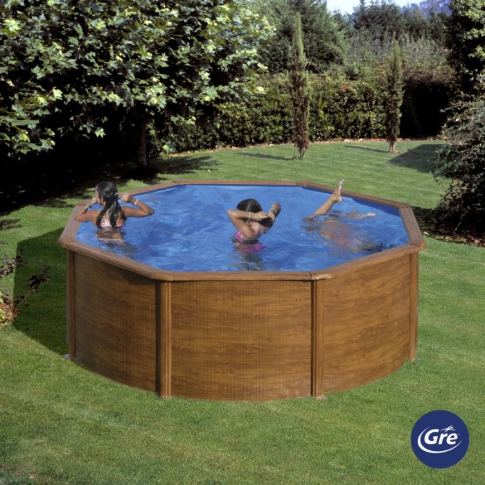 Piscina rotonda Gre Pool Sicilia effetto legno (Ø 350 cm), bambini che nuotano nella piscina da giardino.