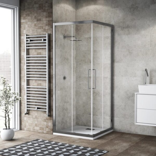 Box doccia angolare con telaio argento e vetro trasparente in bagno moderno.